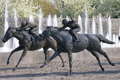 bronze statue of man riding horse